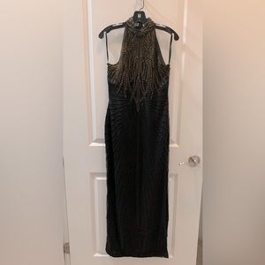 Formal beaded silk gown. Black with gold bead accents.